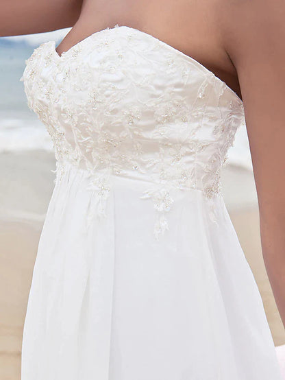 Back view of the A-line strapless chiffon wedding dress, highlighting the court train and delicate appliques.