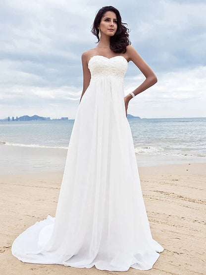 Close-up of the sweetheart neckline and intricate beading appliques on the chiffon wedding dress bodice.