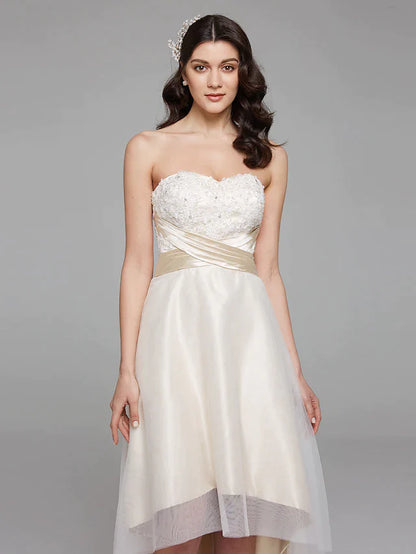 Back view of the A-line wedding dress, featuring a flowing train and elegant bowknot sash.