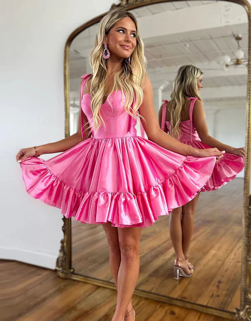 Back view of a pink A-line short homecoming dress.