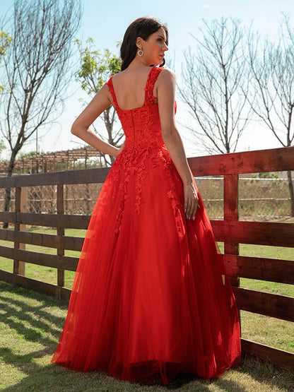 Side view of model in A-line off-shoulder prom dress.