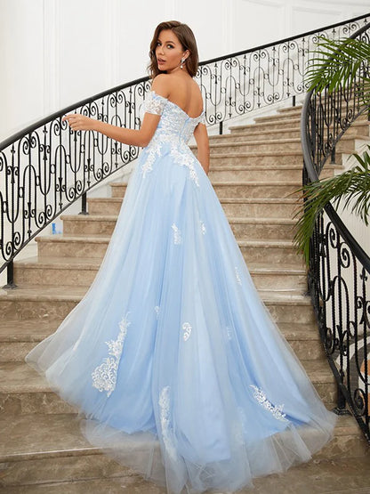 Model wearing a light blue A-line off-shoulder tulle prom dress, side view.