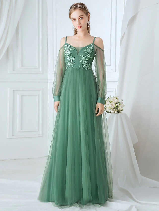 Elegant A-line tulle bridesmaid dress with spaghetti straps and appliques.