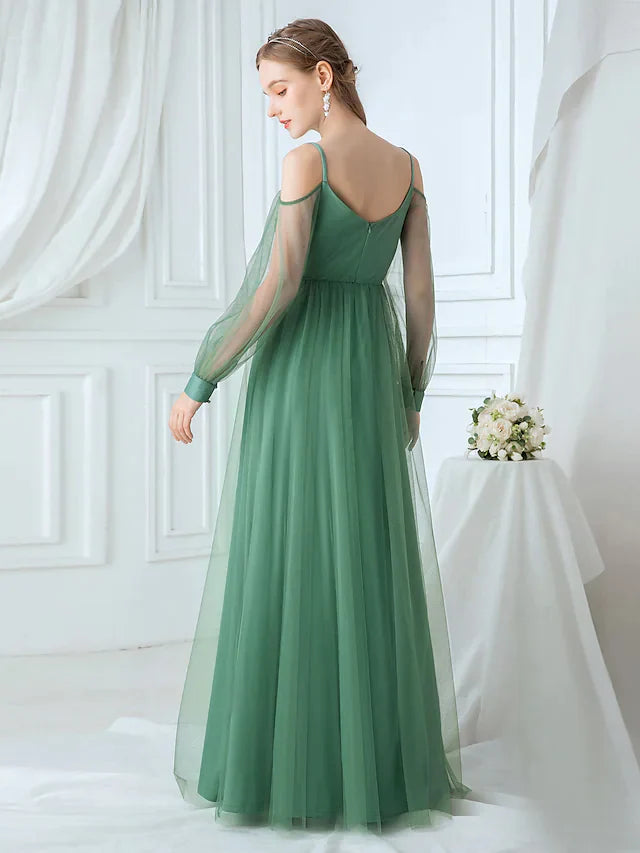 Back view of A-line tulle bridesmaid dress with delicate spaghetti straps.