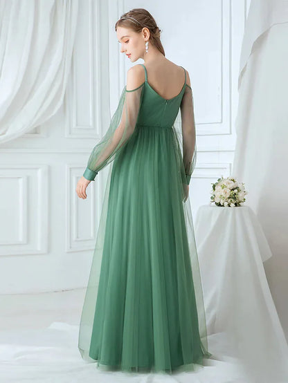Back view of A-line tulle bridesmaid dress with delicate spaghetti straps.