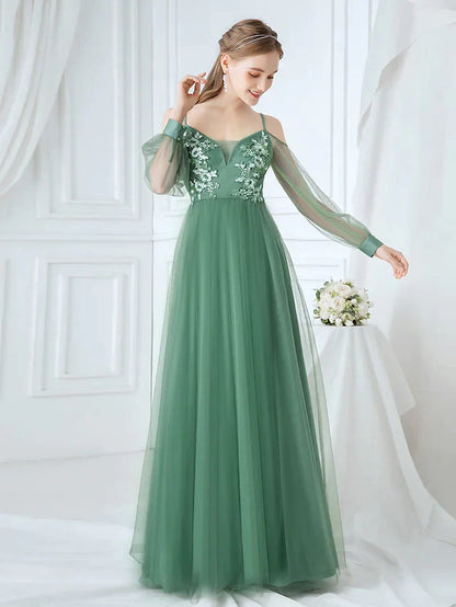 Full length view of a graceful A-line tulle bridesmaid gown.