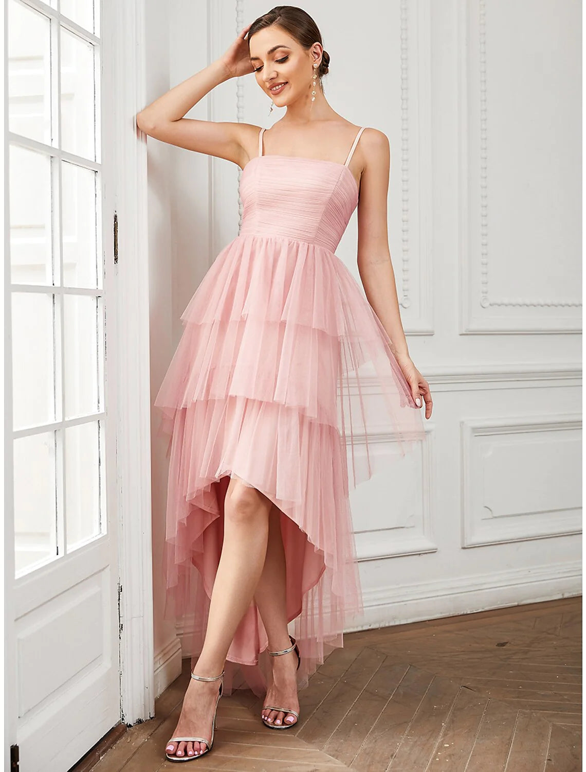 Close-up of the ruched tulle fabric and spaghetti straps on an A-line vintage dress.