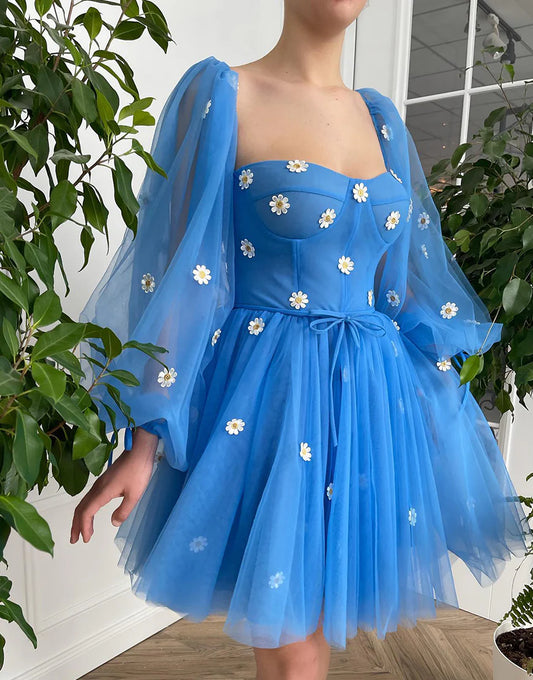 Front view of a model wearing an elegant blue A-line tulle short party dress.