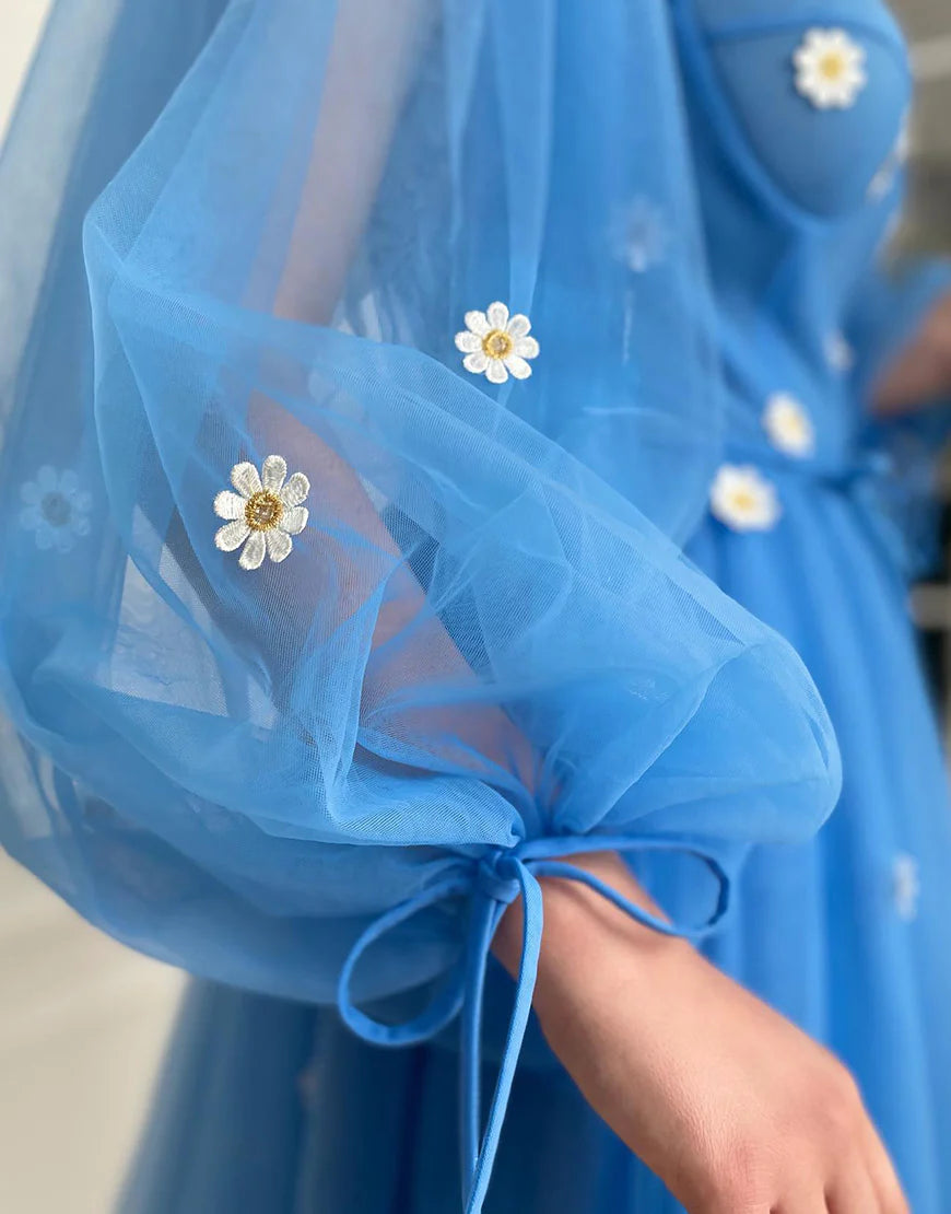 Back view of a model showcasing the blue A-line tulle short formal dress.