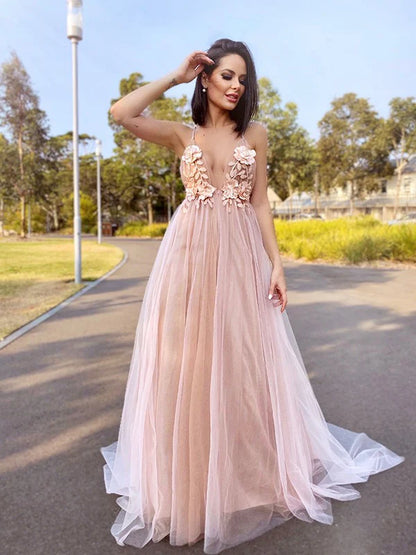 Close-up of the delicate hand-made flower embellishments on the A-line prom dress.