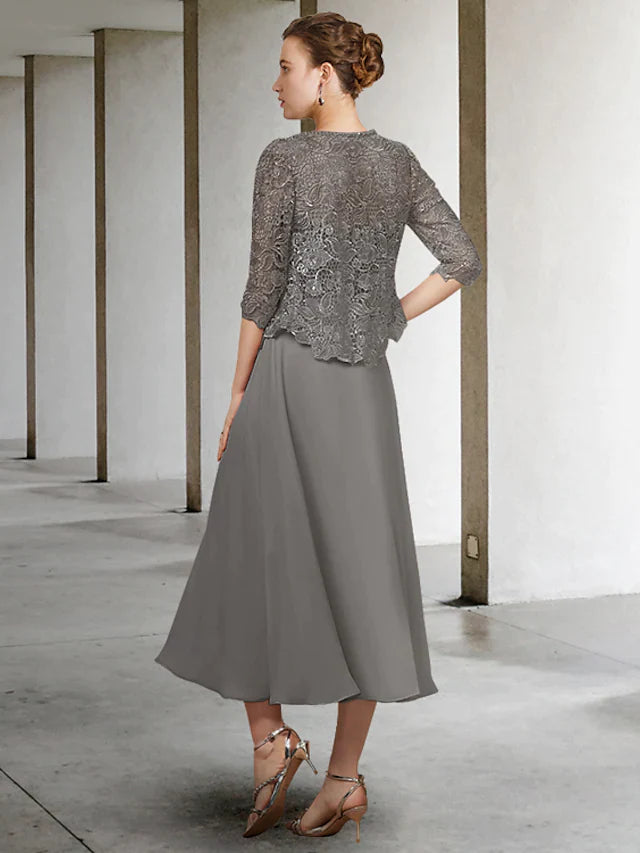 Side view of the A-line two-piece Mother of the Bride dress, showing chiffon lace and pleats.