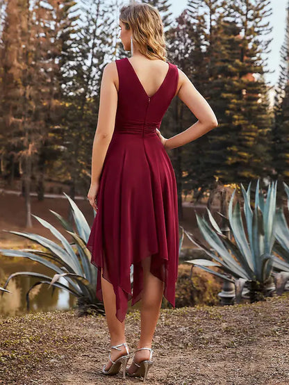 Side view of a model in the teal A-line V-neck ruched chiffon bridesmaid dress, highlighting the asymmetrical hem.