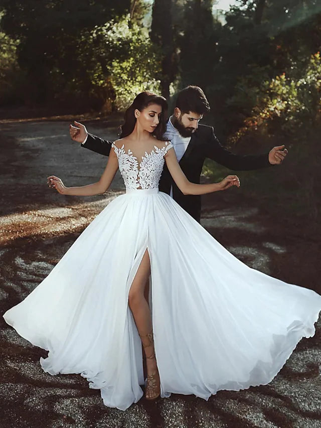 Back view of the A-line wedding dress, highlighting the see-through backless design and train.