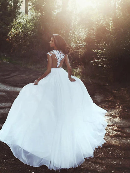 Close-up of the delicate lace bodice and cap sleeve details on the wedding gown.