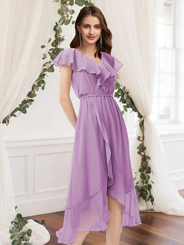 Model wearing an elegant A-line V-neck chiffon bridesmaid dress with asymmetrical ruffles and pleats.