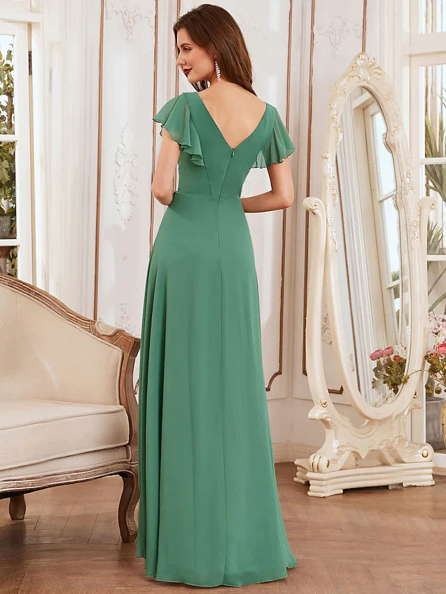 Close-up of the delicate asymmetrical ruffles and V-neckline on the light blue chiffon dress.