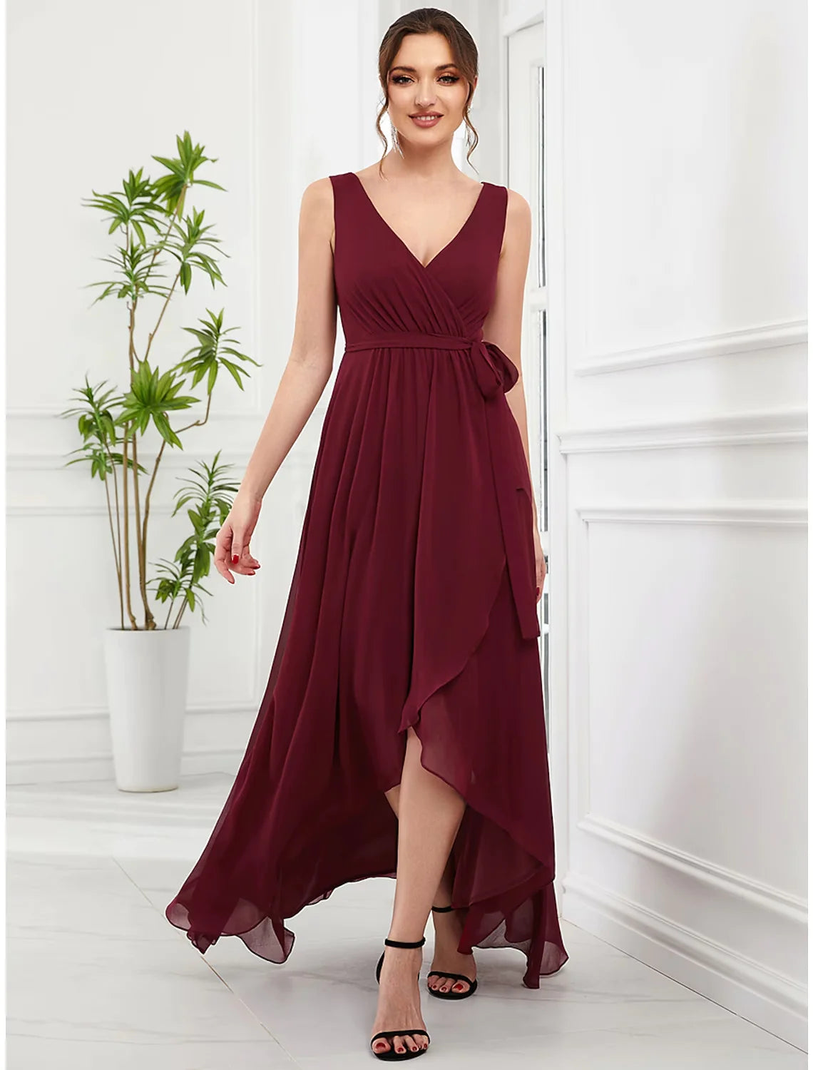 Model wearing an elegant A-line V-neck chiffon dress with ruffles.
