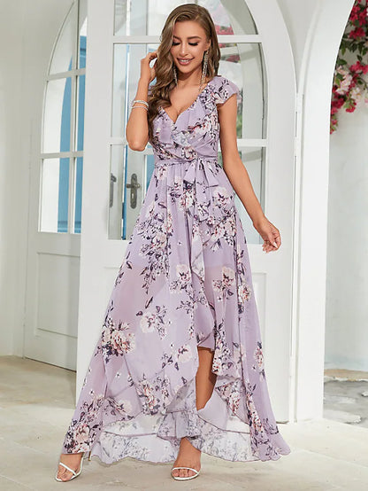 Full length view of a woman posing in a flowing A-line floral dress, perfect for special occasions.