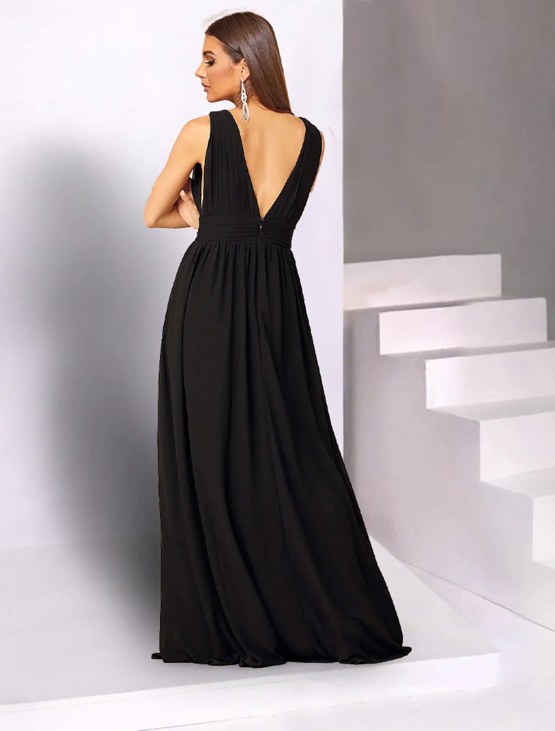 Model in a flowing A-line V-neck chiffon dress, highlighting the elegant floor-length silhouette and fabric.