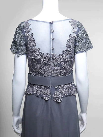 Close-up of the delicate lace bodice and V-neck detail of the dress.