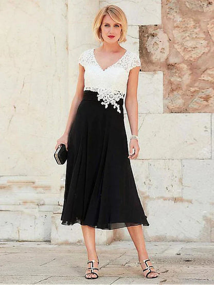Plus size A-line V-neck tea length mother of the bride dress with lace and ruching, front view.