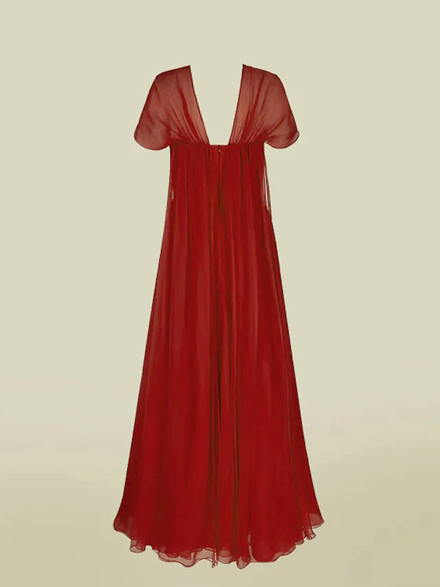Model in an A-line V-neck chiffon dress, showing the back and flowing skirt.