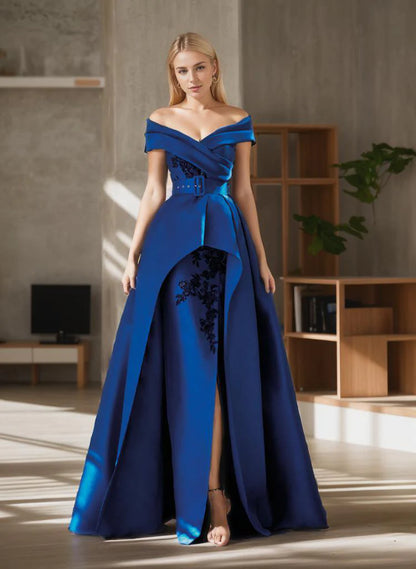 Woman wearing a navy blue A-line floor-length evening gown, front view.
