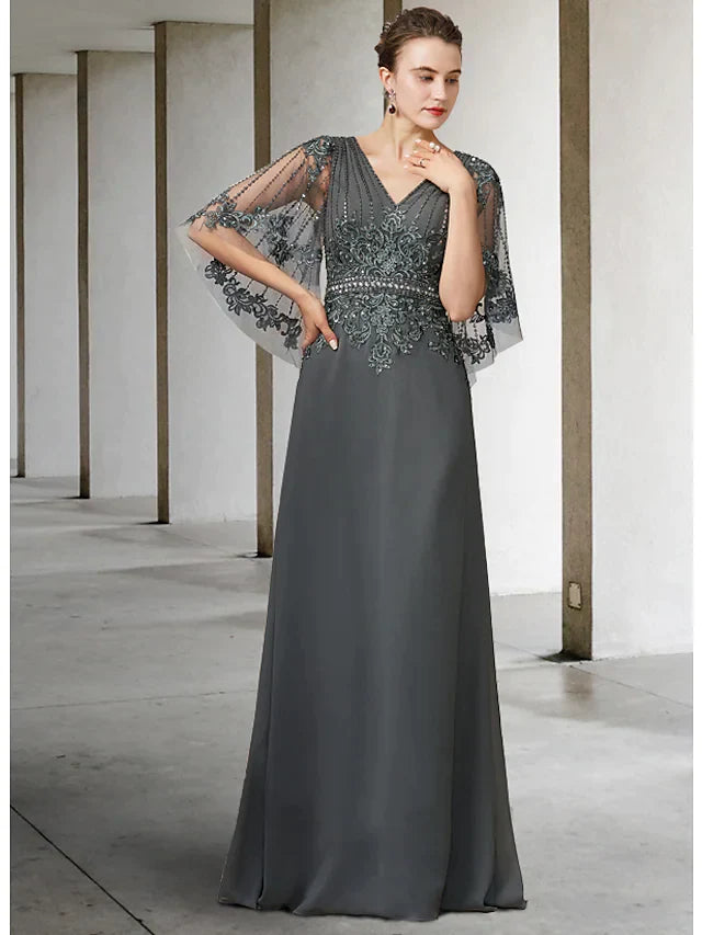Elegant A-line mother of the bride dress in navy blue with V-neck, half sleeves, and lace details.