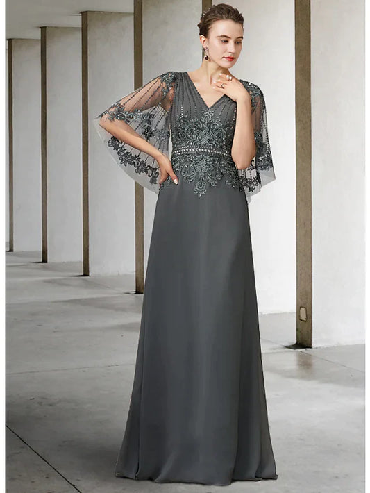 Elegant A-line mother of the bride dress in navy blue with V-neck, half sleeves, and lace details.