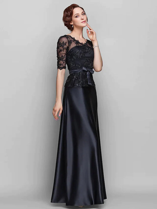 Woman wearing an elegant A-line V-neck Mother of the Bride dress in navy blue, front view.