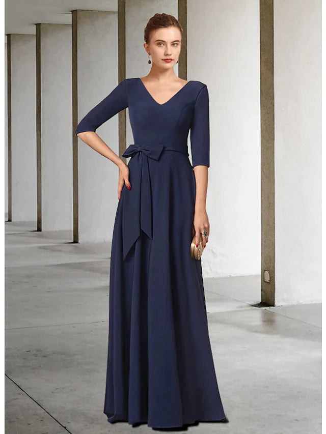 Elegant dark blue V-neck mother of the bride dress with half sleeves, pleats, and a sash, front view.