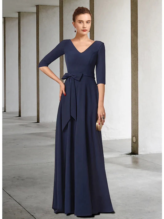 Elegant dark blue V-neck mother of the bride dress with half sleeves, pleats, and a sash, front view.