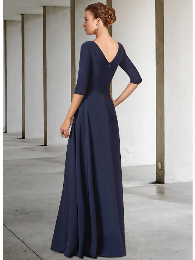 Dark blue floor-length mother of the bride gown featuring a V-neck, half sleeves, and a detailed sash with pleats.