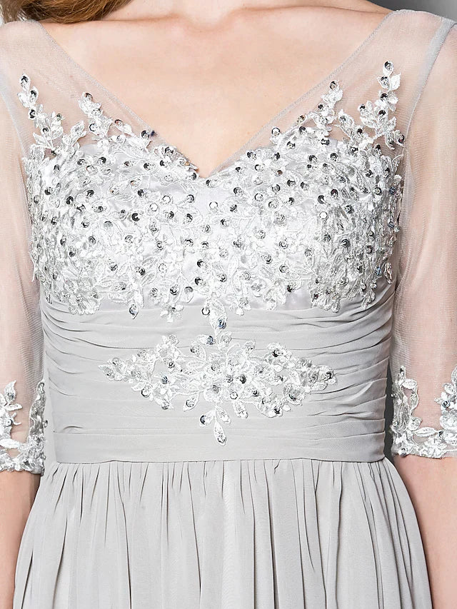 Back view of a woman showcasing the elegant A-line Mother of the Bride dress with delicate sequins.