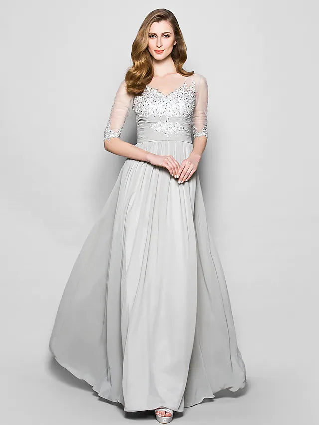 Close-up of the V-neckline and half sleeves on the Mother of the Bride dress with ruched details.
