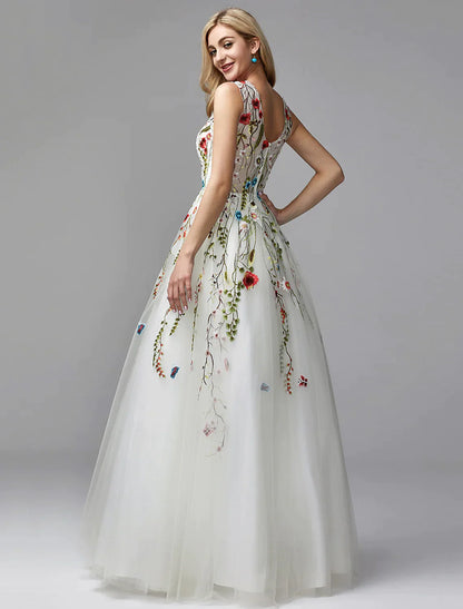 Back view of a model in a white A-line special occasion dress with lace details.