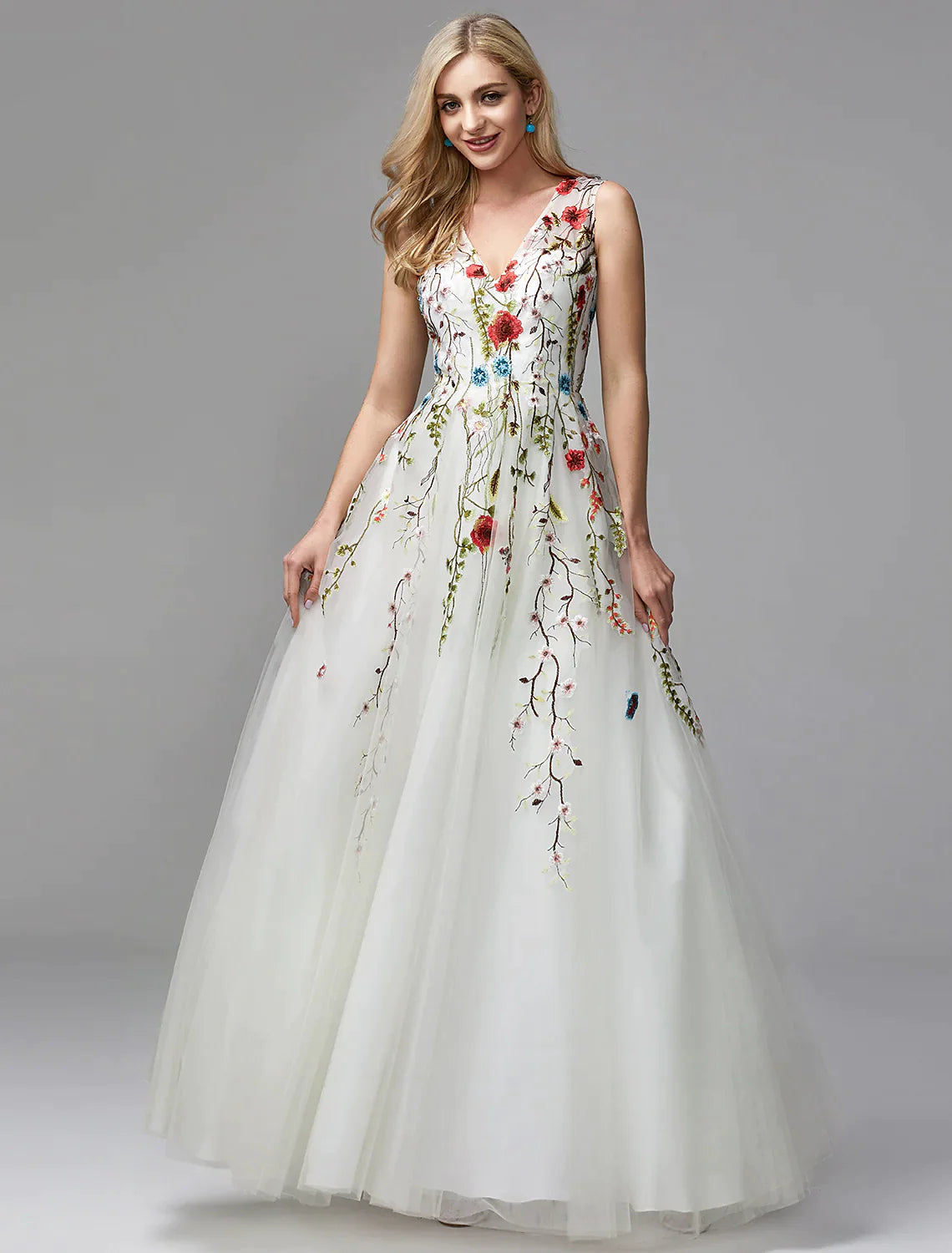 Full view of the elegant white A-line dress with intricate lace appliques.