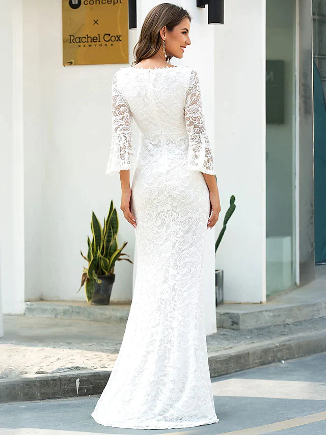 Close-up of the lace detailing on the long illusion sleeve of the wedding dress.