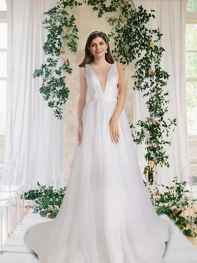 Elegant A-Line V-neck wedding dress with lace and tulle, featuring a court train and sequin details.