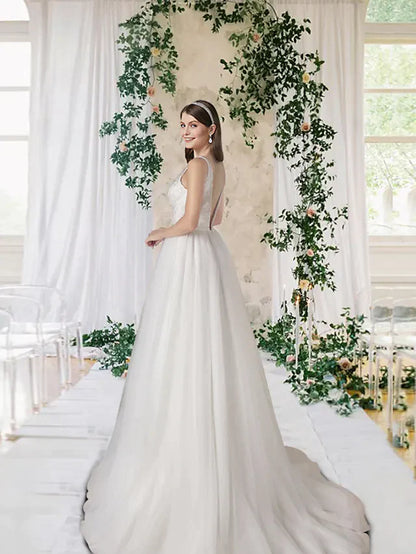 Close-up of the A-Line wedding dress showing V-neck, lace bodice, and sequin embellishments.