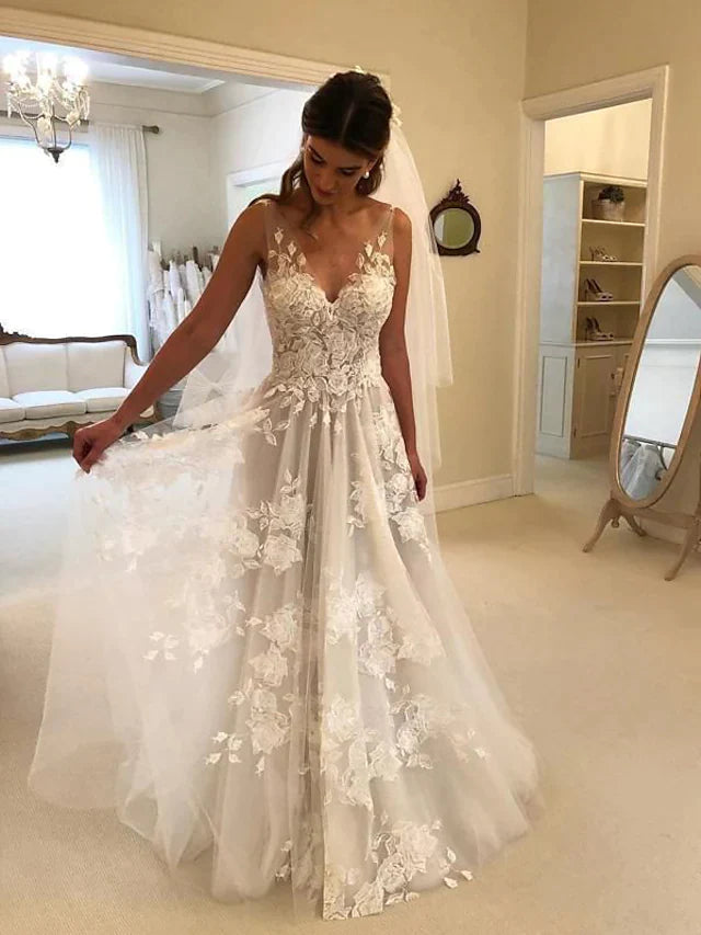 Elegant A-Line V-neck lace wedding dress with court train and regular straps.