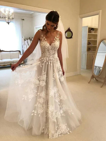 Elegant A-Line V-neck lace wedding dress with court train and regular straps.