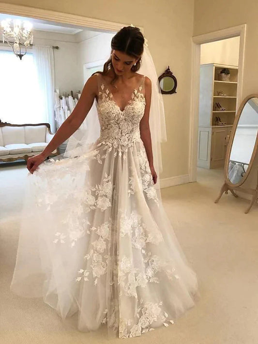 Elegant A-Line V-neck lace wedding dress with court train and regular straps.