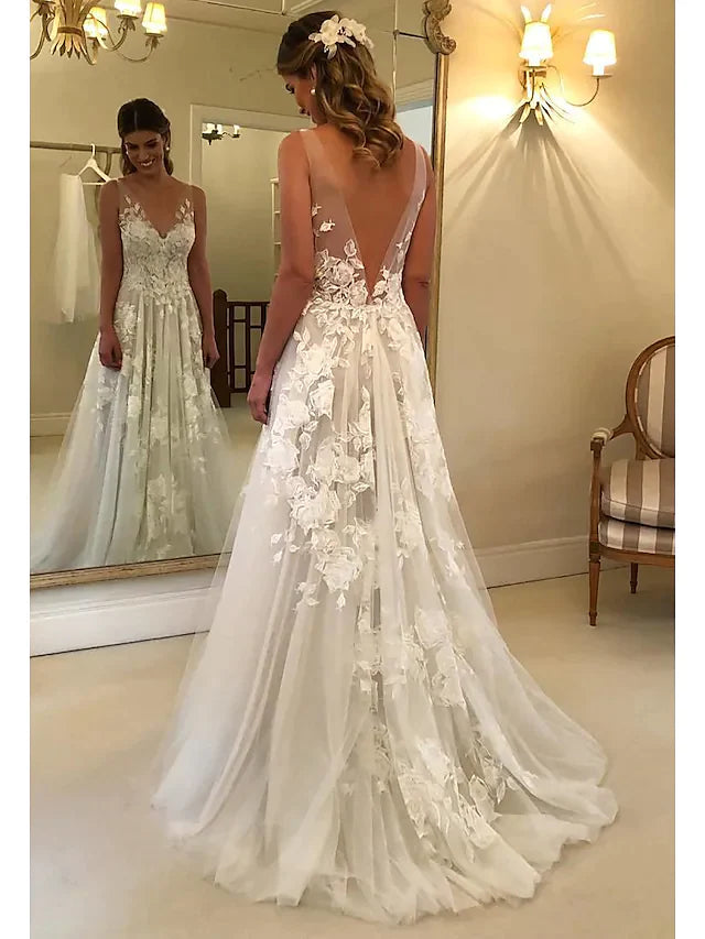 Close-up view of the lace detailing and V-neckline on the A-Line wedding dress.