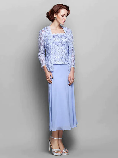 Elegant tea-length mother of the bride dress in light blue chiffon with lace details and matching wrap.