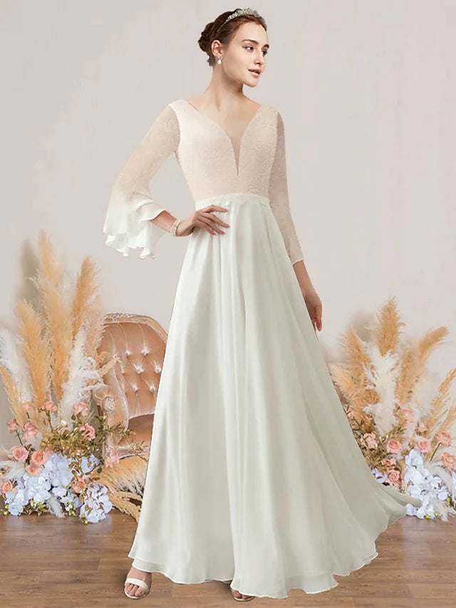 Elegant A-Line V-neck long sleeve wedding dress with lace and appliques.