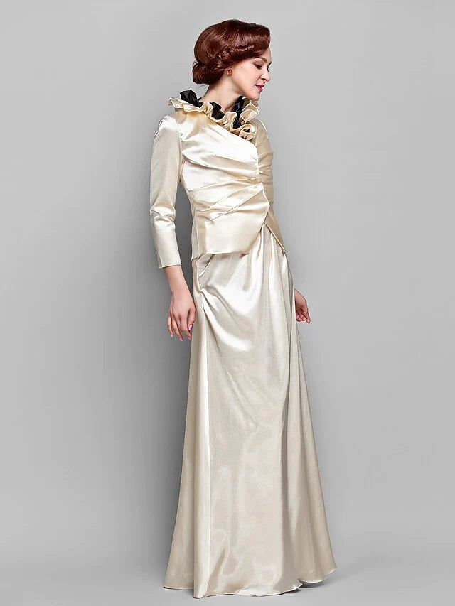 Close-up of the stretch satin fabric, ruffles, and side draping details on the elegant dress.