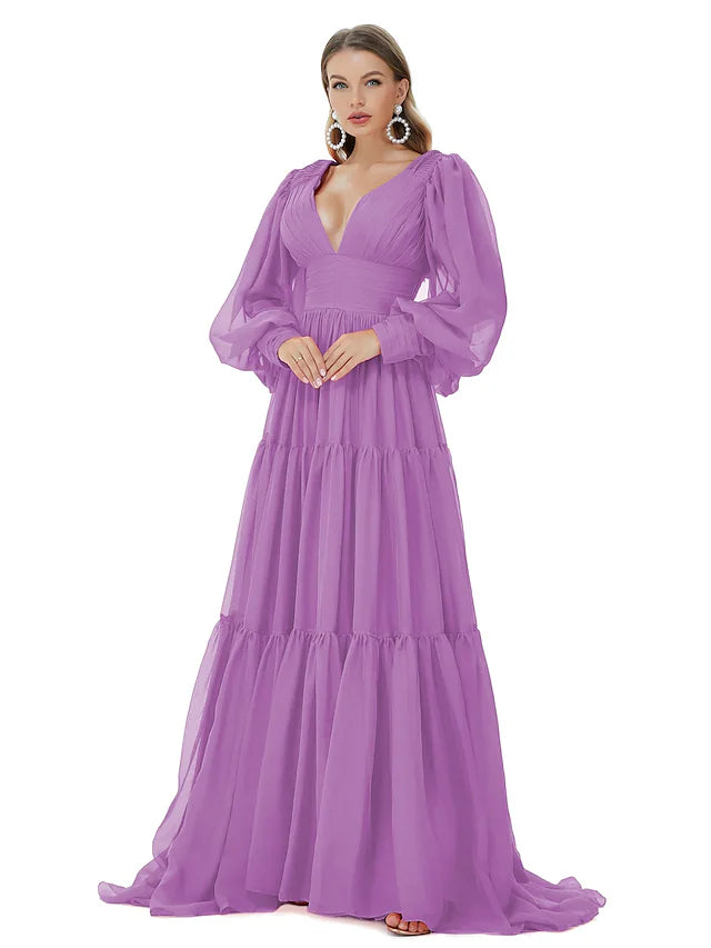 Close-up of the V-neckline and ruched bodice on a blue chiffon gown.