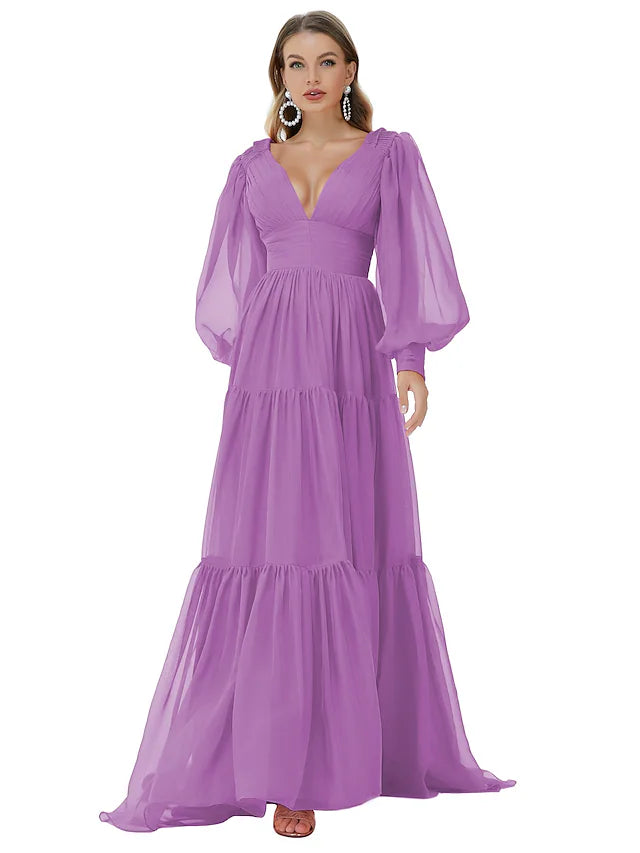 Back view of a blue A-line long sleeve evening gown with a sweep train.