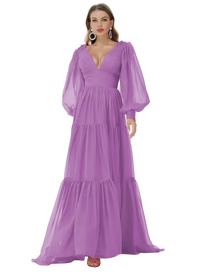 Back view of a blue A-line long sleeve evening gown with a sweep train.